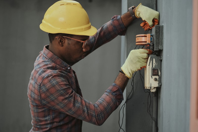 Electrician installing wiring in a residential property